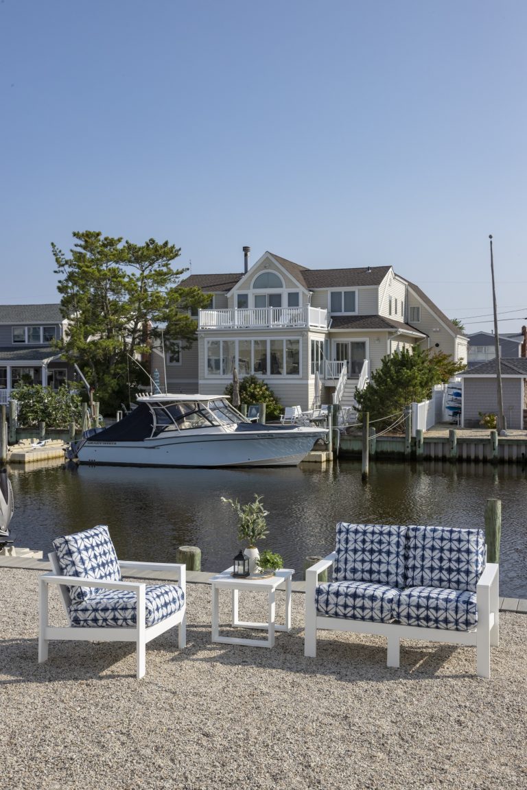 Patterned loveseat and chair by the docks
